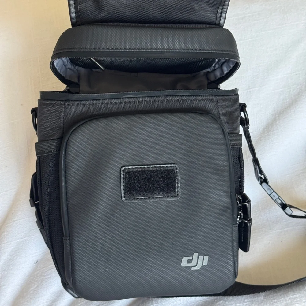 DJI Mavic Black Messenger Bag with Adjustable Strap and Minimalist Design